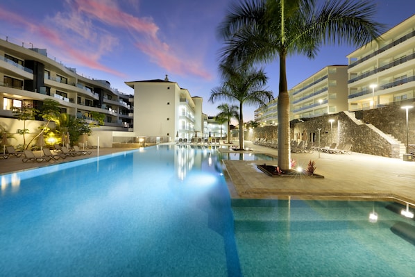 2 outdoor pools, open 9:00 AM to 8:00 PM, pool umbrellas, pool loungers