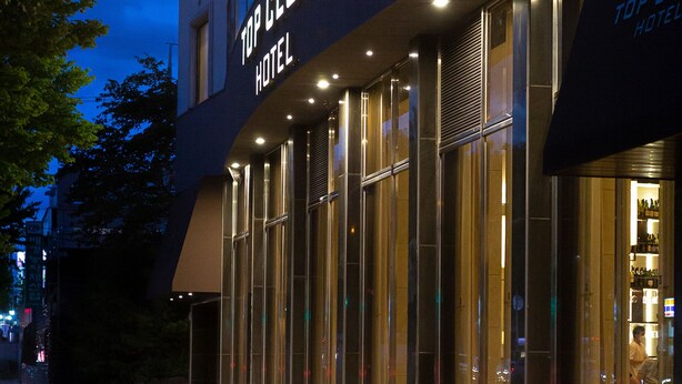 A modern hotel exterior with a prominent sign reading "Top Cloud Hotel." - Topcloud Hotel Iksan (Iksan)
