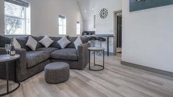 Apartment (2 Bedrooms) | Living area | 32-inch Smart TV with cable channels, TV