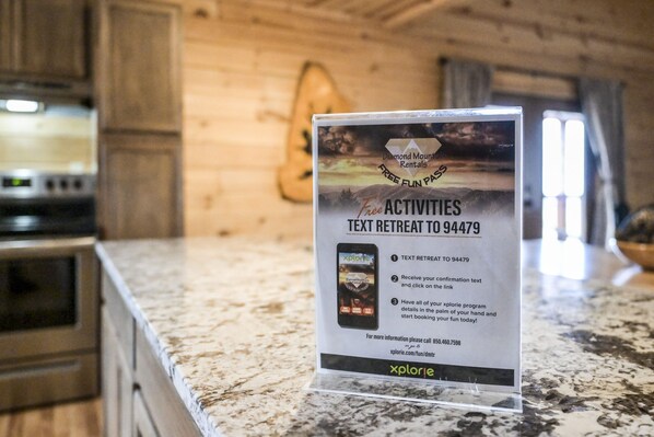 A sign in a kitchen area advertising a text retreat to 94479.