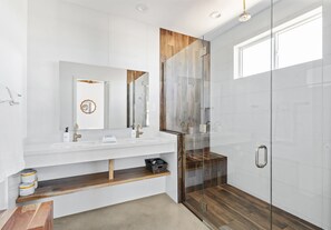 Shower, hair dryer, towels, shampoo
