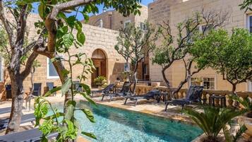 Seasonal outdoor pool, pool loungers