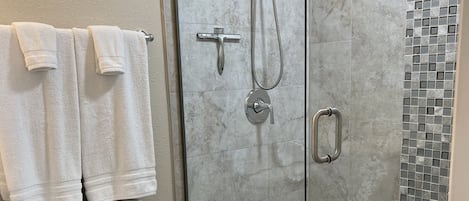 Shower, hair dryer, towels, soap