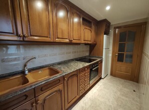 Fridge, oven, coffee/tea maker, cookware/dishes/utensils