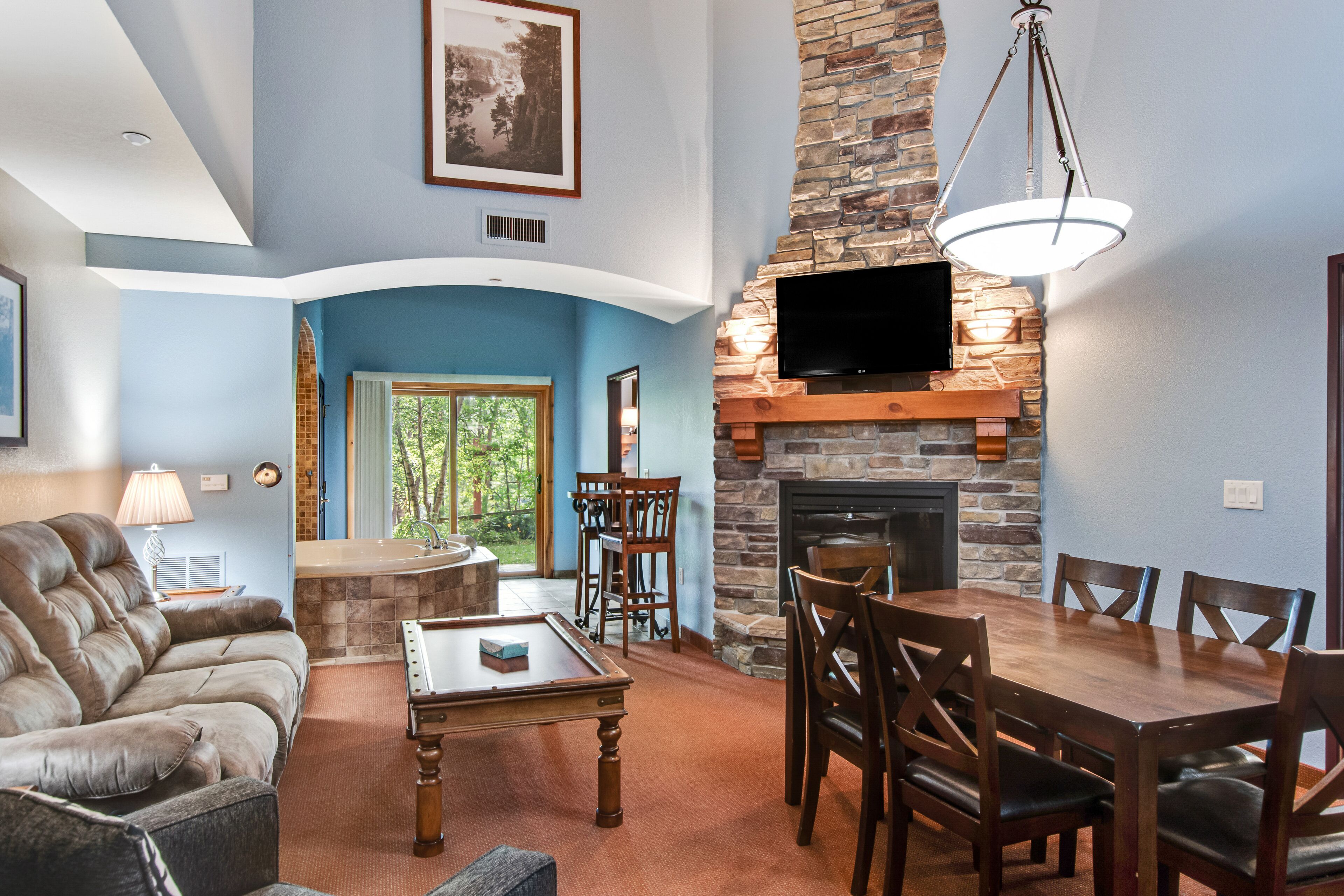 Inviting ground-floor condo with fireplace, patios, AC, & jetted tub