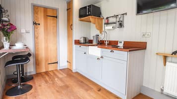 Fridge, electric kettle, toaster, cookware/dishes/utensils
