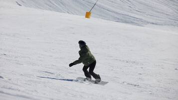 A snowboarder on a snowy slope.