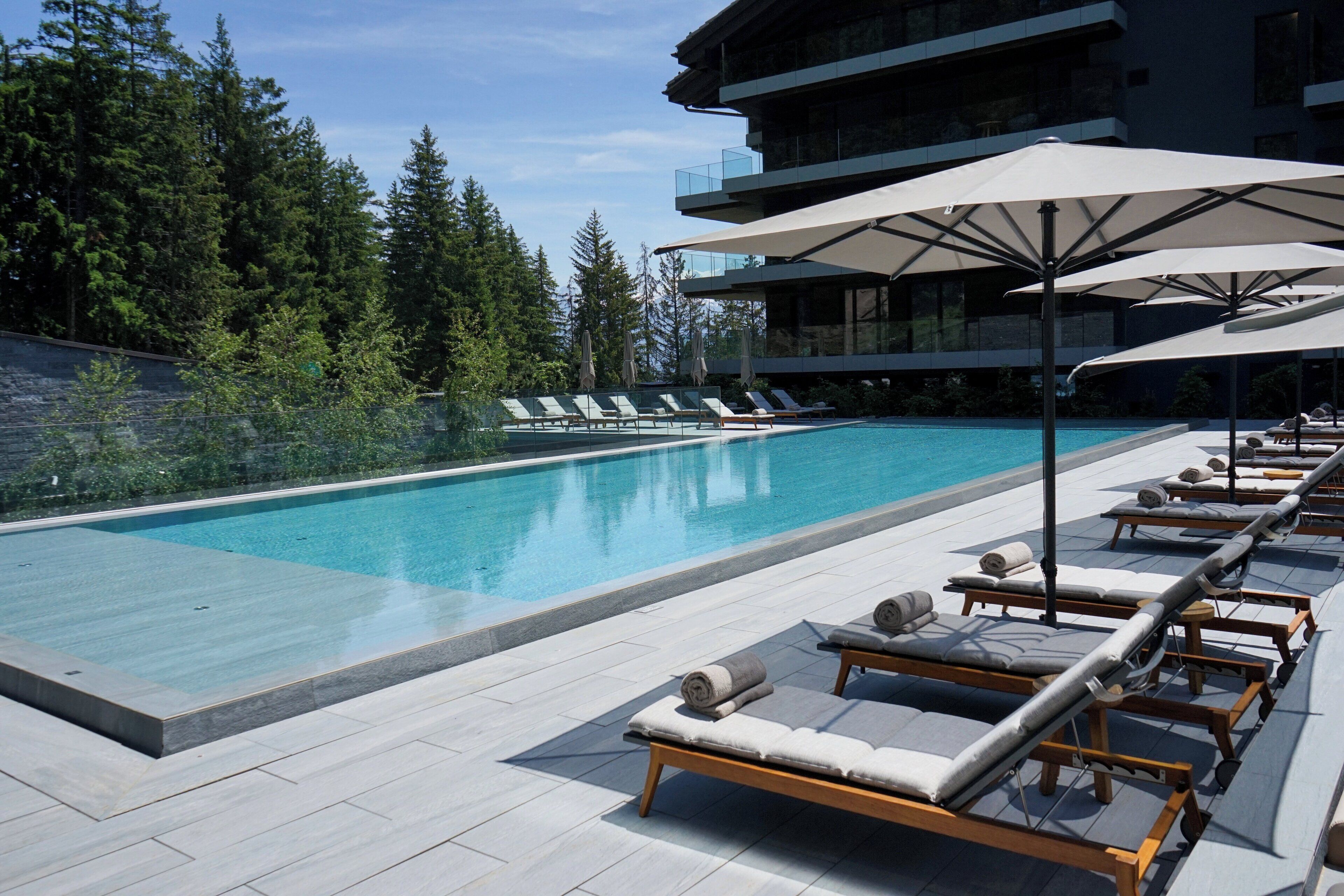 Indoor pool, outdoor pool, pool umbrellas, sun loungers