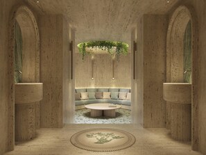 A modern interior with a central seating area, a round coffee table, and a patterned floor. - Six Senses Rome (Rome)