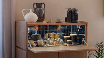 A kitchen counter with various coffee-making equipment and utensils.
