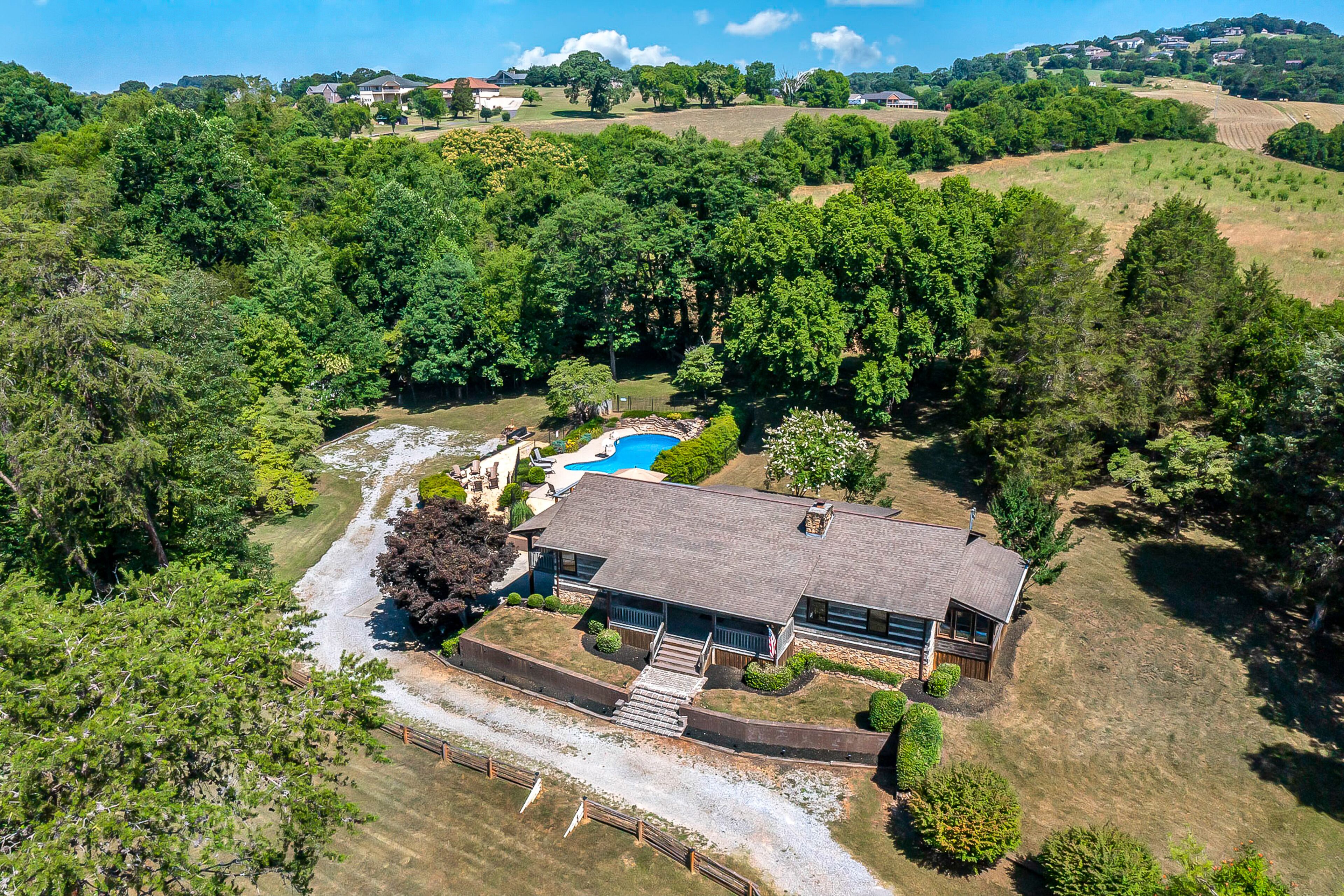 Serene cabin with pool, hot tub, game room, fireplace, & washer/dryer