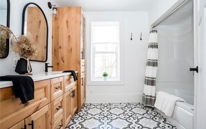 Combined shower/tub, hair dryer, towels, soap