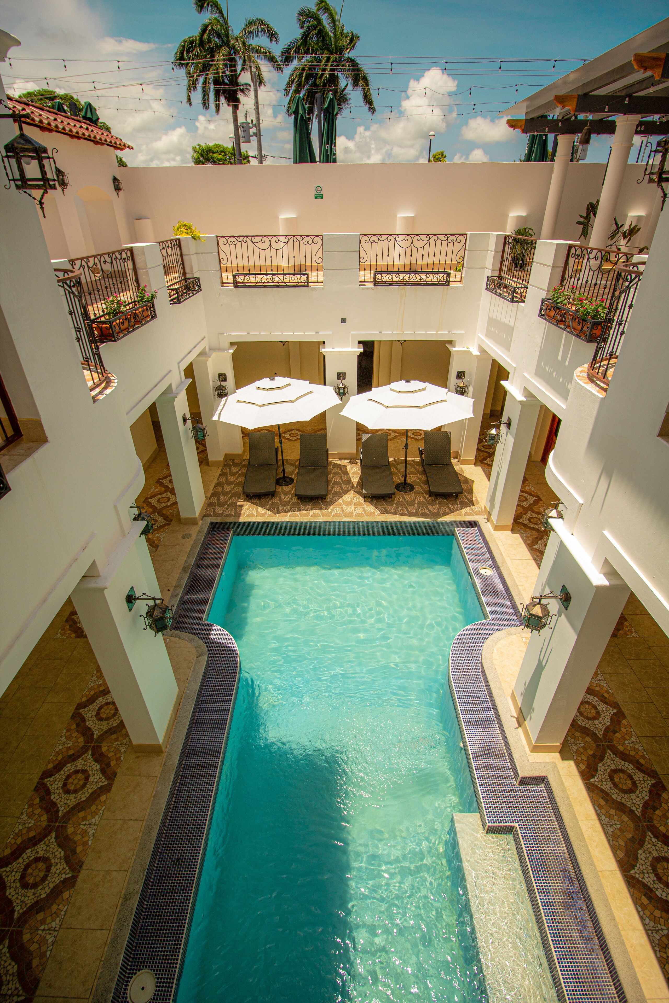 Outdoor pool, open 7:00 AM to 8:00 PM, pool umbrellas