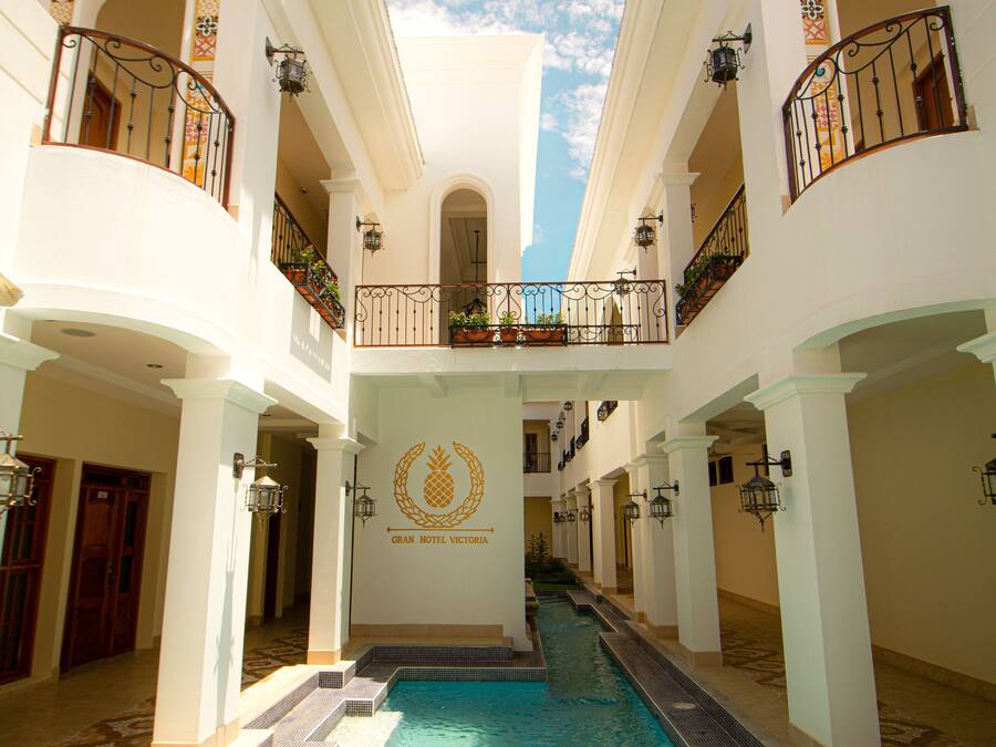 Outdoor pool, open 7:00 AM to 8:00 PM, pool umbrellas