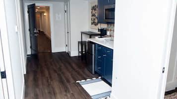 Fridge, microwave, coffee/tea maker, cookware/dishes/utensils
