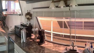 Fridge, microwave, coffee/tea maker, paper towels