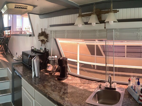 Fridge, microwave, coffee/tea maker, paper towels