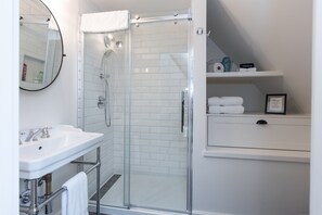Shower, eco-friendly toiletries, hair dryer, towels