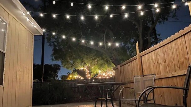 A patio with string lights, a table, and chairs. - Casita Chica (McAllen)