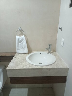 Shower, rainfall showerhead, hair dryer, towels