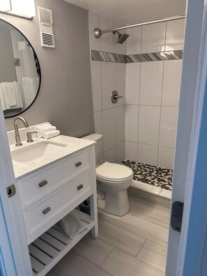 Shower, towels, soap, toilet paper