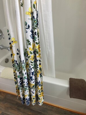 Combined shower/tub, hair dryer, towels, soap