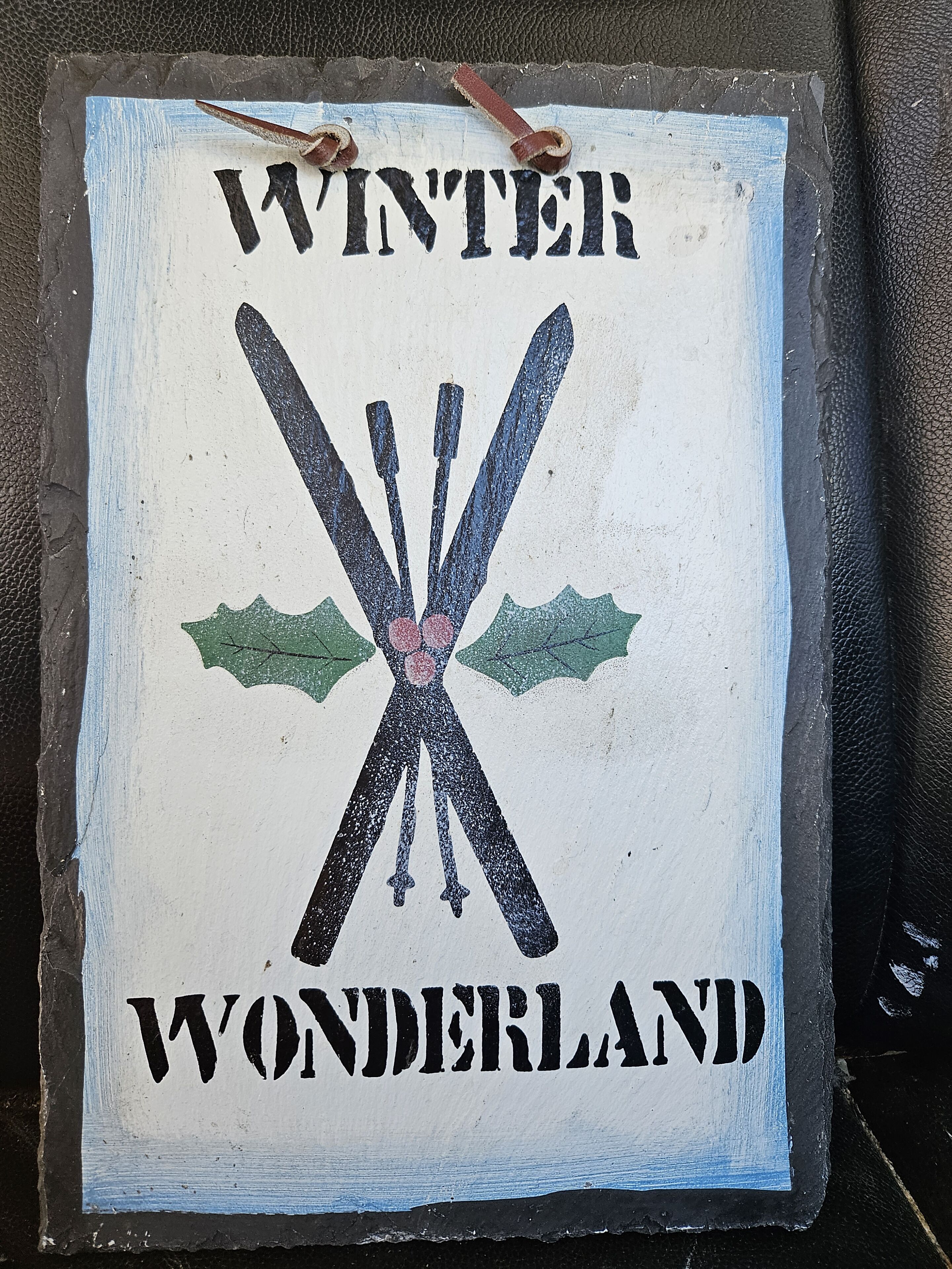A sign with the text "WINTER WONDERLAND" and a graphic of crossed skis.