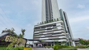 A modern multi-story building with a prominent entrance and a sign that reads "GREENFIELD Residence". - Greenfield Residence at Bandar Sunway (Petaling Jaya)