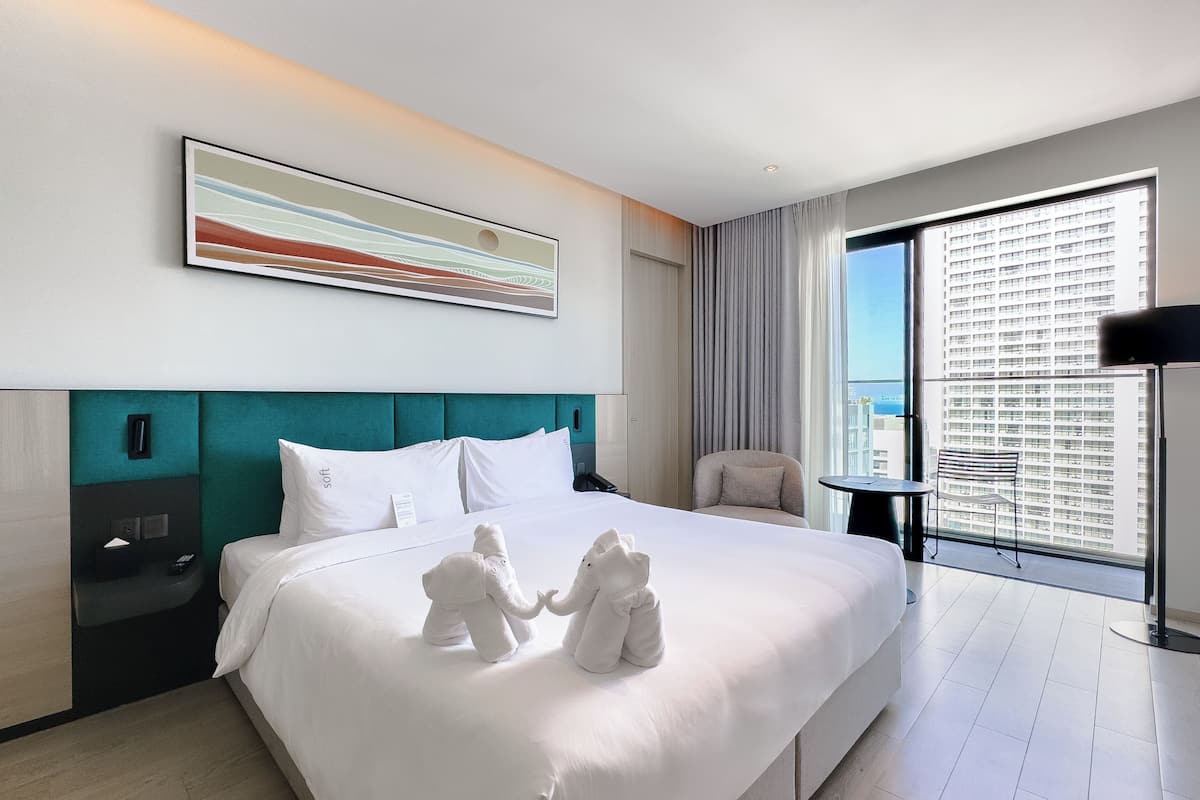 Family Room, Sea View | Minibar, in-room safe, desk, laptop workspace