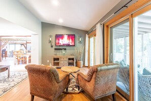 Smart TV, fireplace, table football, books