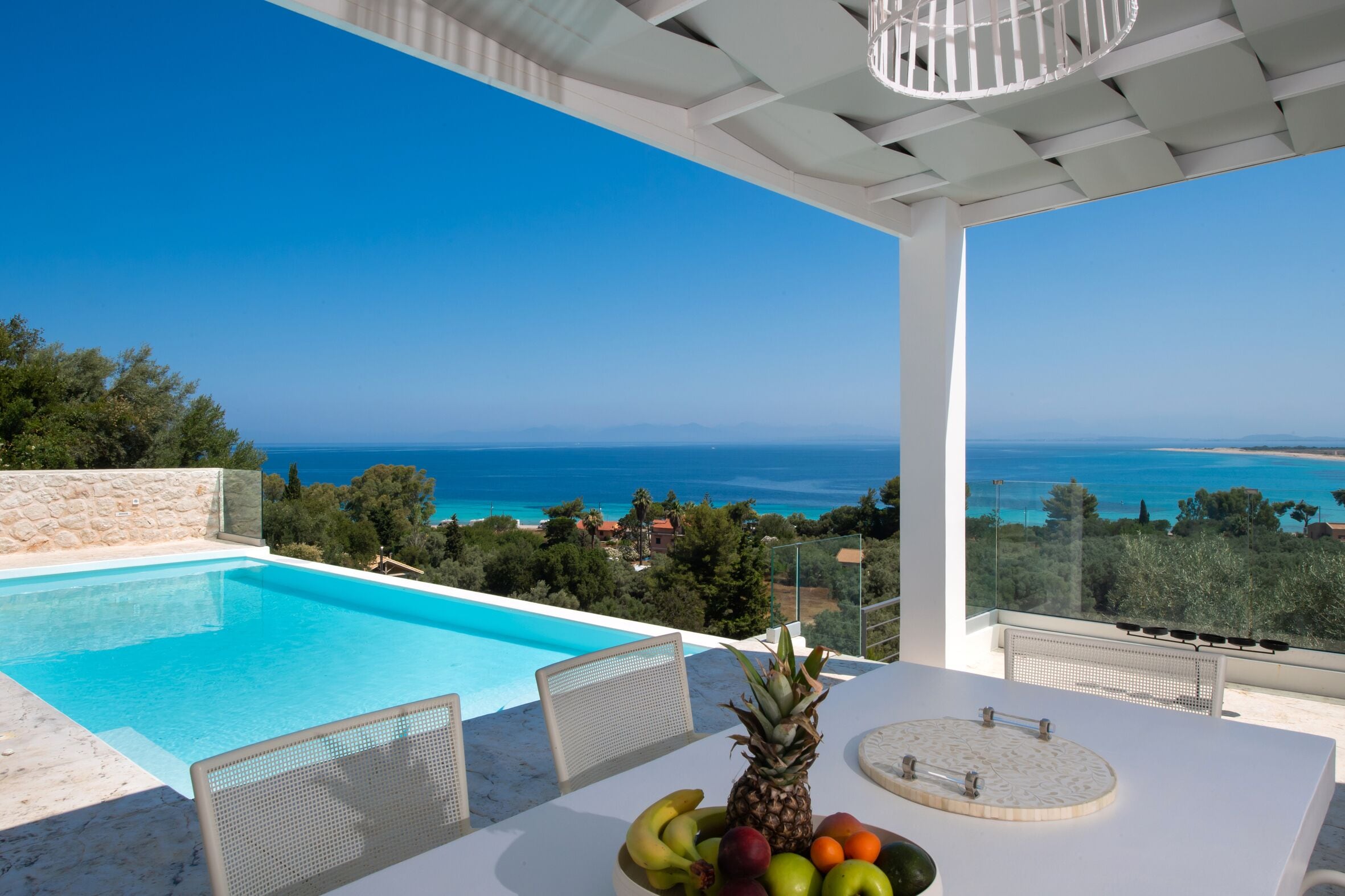 An infinity pool, sun loungers