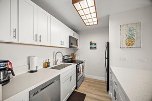 Fridge, microwave, oven, stovetop - Kapaa Shore Resort A101, Oceanfront, King Bed, Ground Floor, End Unit, AC (Kapaa)