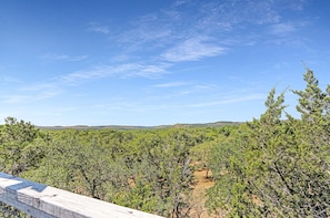 A view of a forested landscape with a clear sky.
