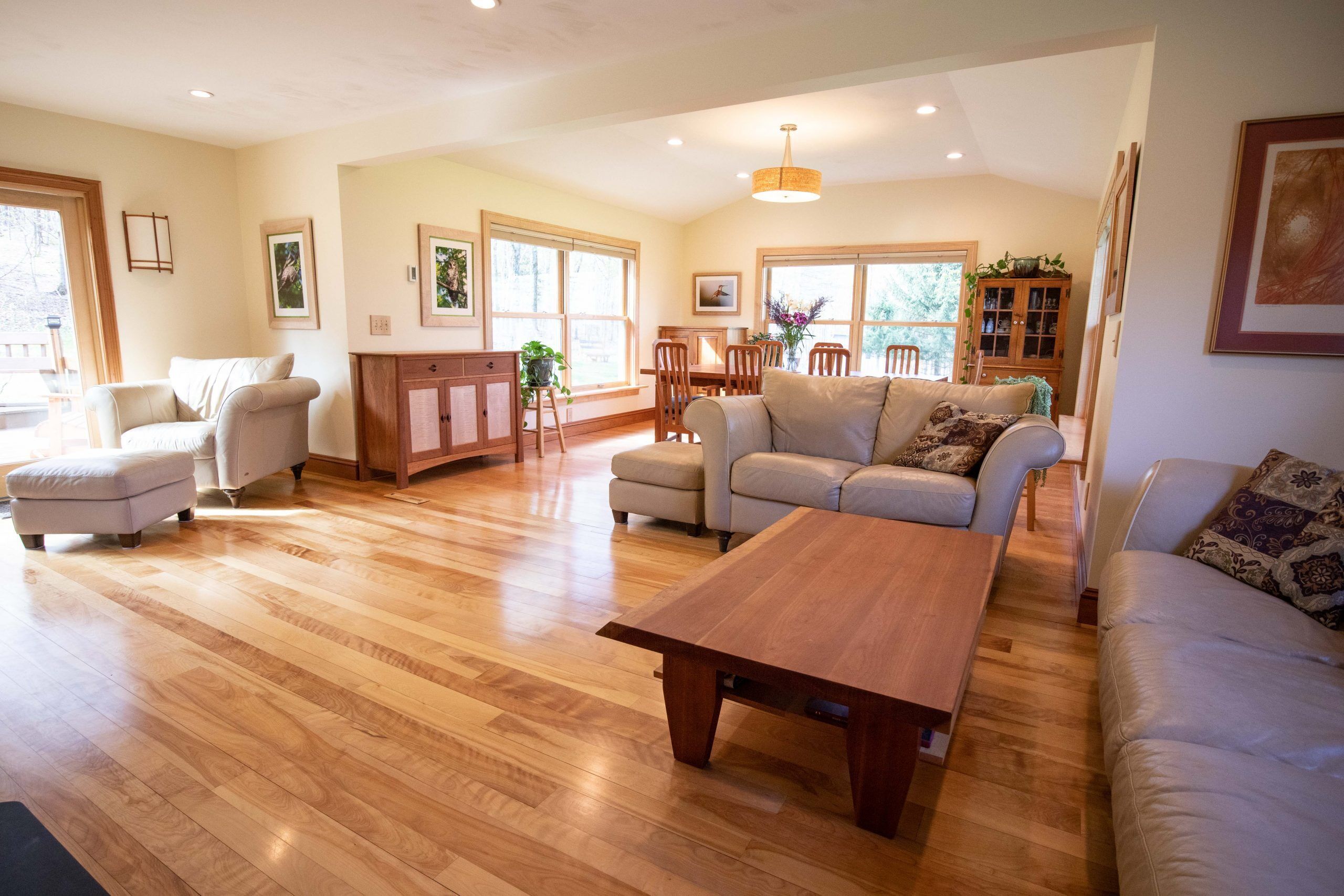 Living room contains large dining table; can seat 8 people; overlooks backyard