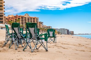 On the beach, sun-loungers, beach towels