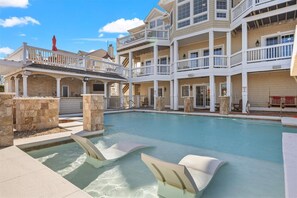 A heated pool, sun loungers
