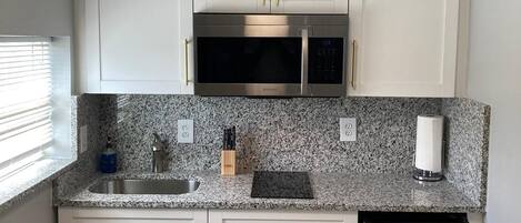 Fridge, microwave, stovetop, coffee/tea maker