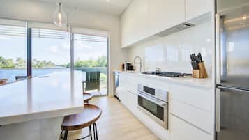 Deluxe Condo, 2 Bedrooms, Canal View | Private kitchen | Full-size fridge, microwave, oven, stovetop