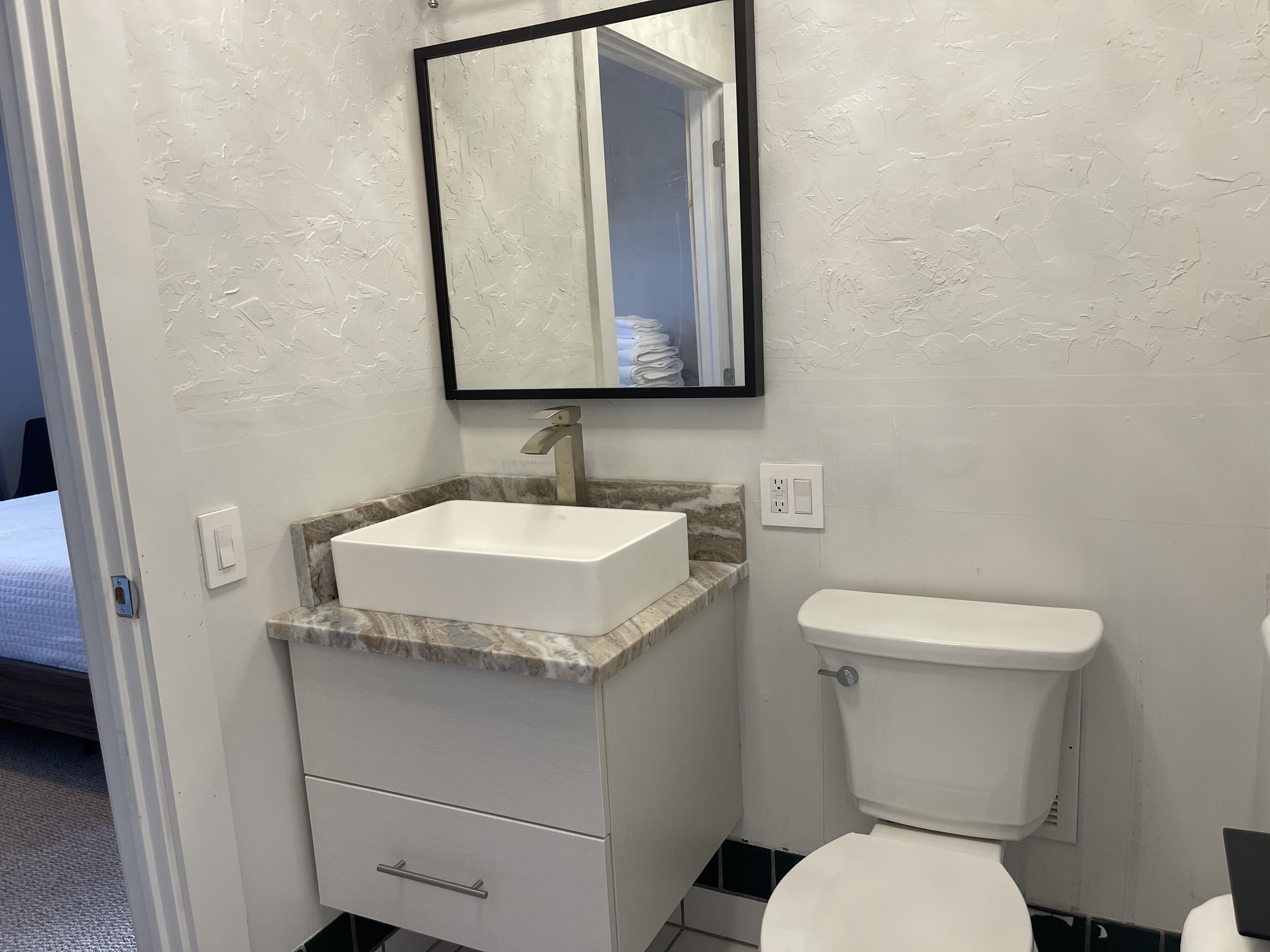 Bathtub, hair dryer, bidet, towels