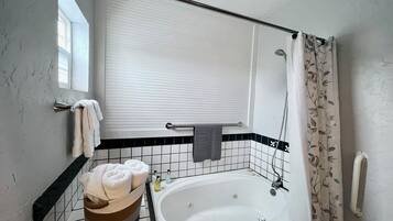 Bathtub, hair dryer, bidet, towels