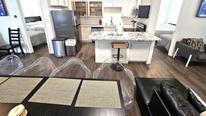 A compact apartment with a kitchenette, a dining area, and a living space. - "Molly”-Sea Isle w/Gulf View, Pool,yard,2 kayaks, 8min walk 2beach, Dog friendly (Galveston)