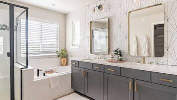 Combined shower/bathtub, hair dryer, towels, soap