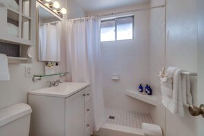 Shower, hair dryer, towels, shampoo