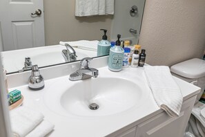 Combined shower/tub, towels, soap, shampoo