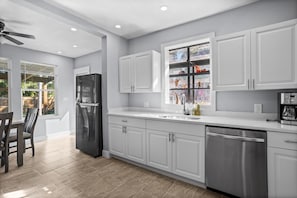 Coffee/tea maker, fridge, microwave, oven