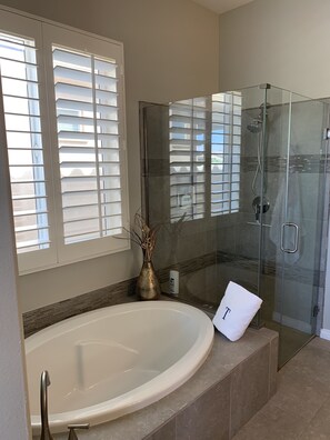 Bathtub, hair dryer, towels, soap