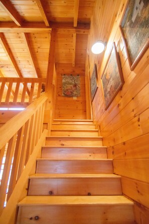 A wooden staircase with a handrail, leading to a lower level. - Beary Cozy Cabin in the woods near private lake! Near Lake Lure/ Chimney Rock, (Lake Lure)