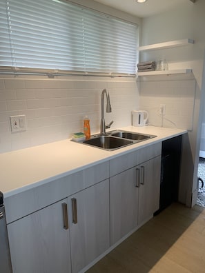 Fridge, microwave, stovetop, coffee/tea maker