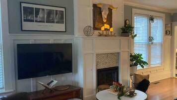 TV, fireplace, books, offices