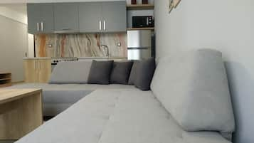 Deluxe Apartment | Living area | Flat-screen TV, Netflix, heated floors, streaming services